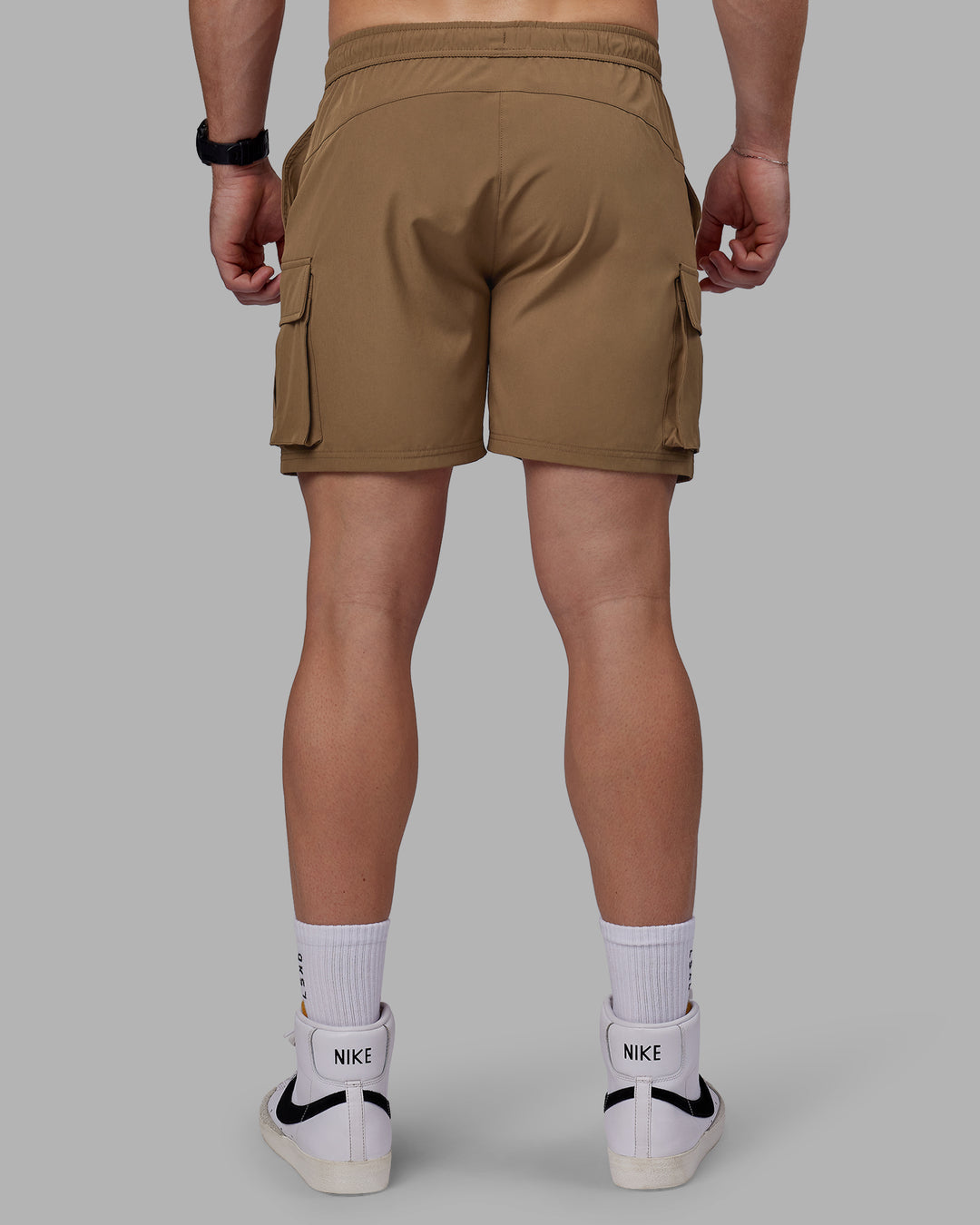 Man wearing Energy Stretch Performance Cargo Shorts - Otter