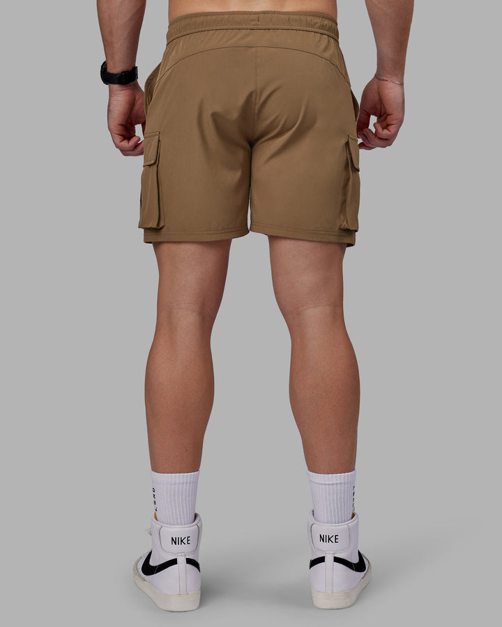 Man wearing Energy Stretch Performance Cargo Shorts - Otter
