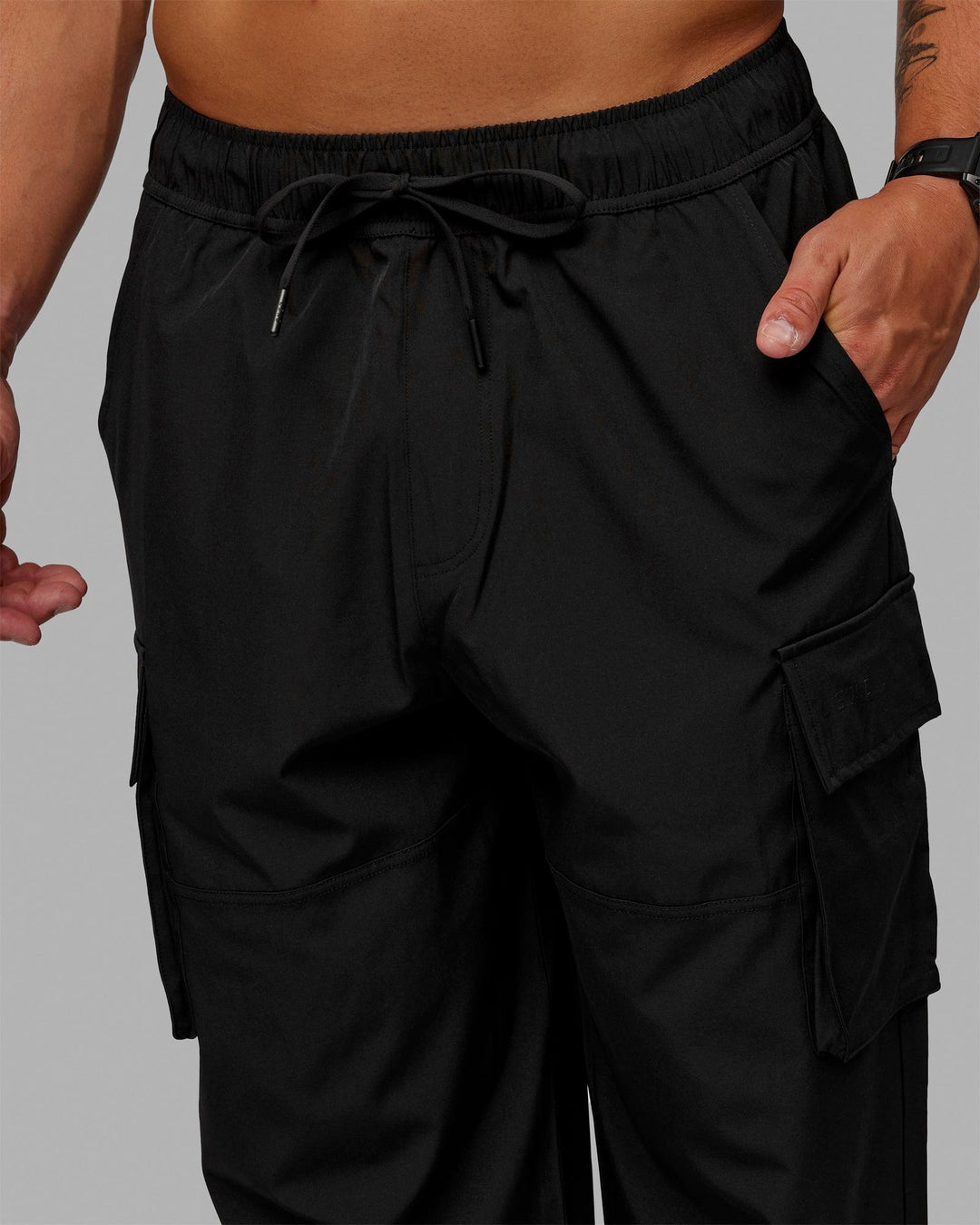 Man wearing Energy Stretch Relaxed Fit Cargo Pants - Black