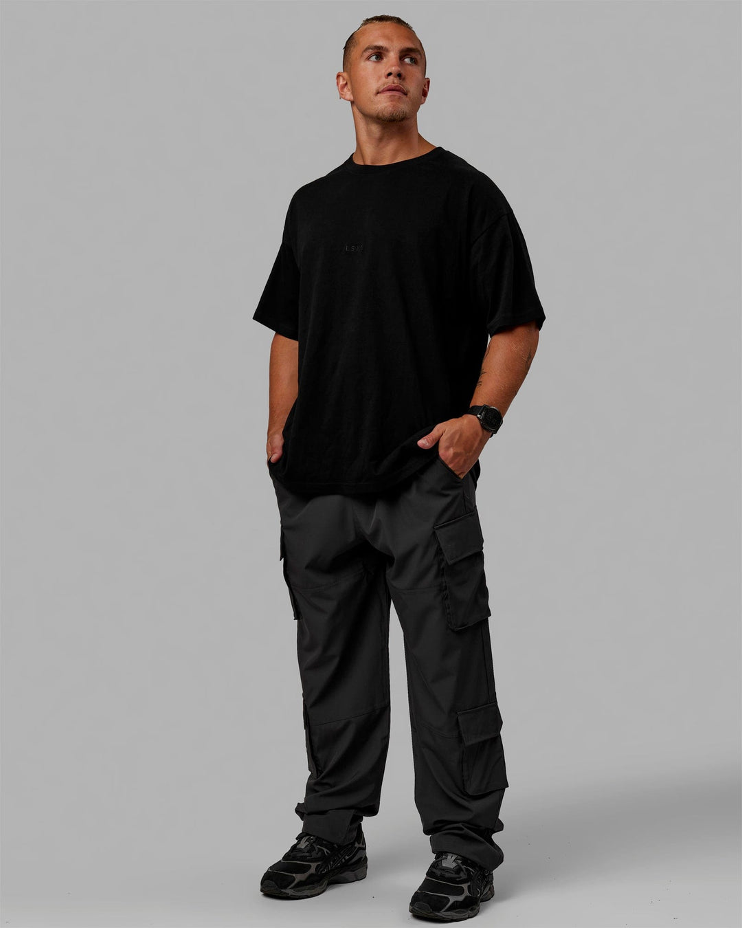 Man wearing Energy Stretch Relaxed Fit Cargo Pants - Pirate Black