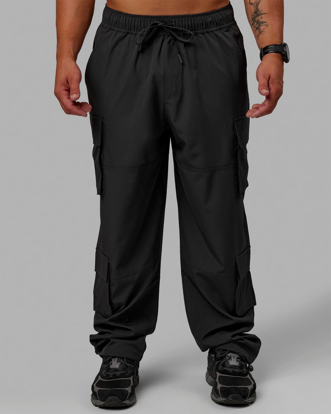 Man wearing Energy Stretch Relaxed Fit Cargo Pants - Pirate Black