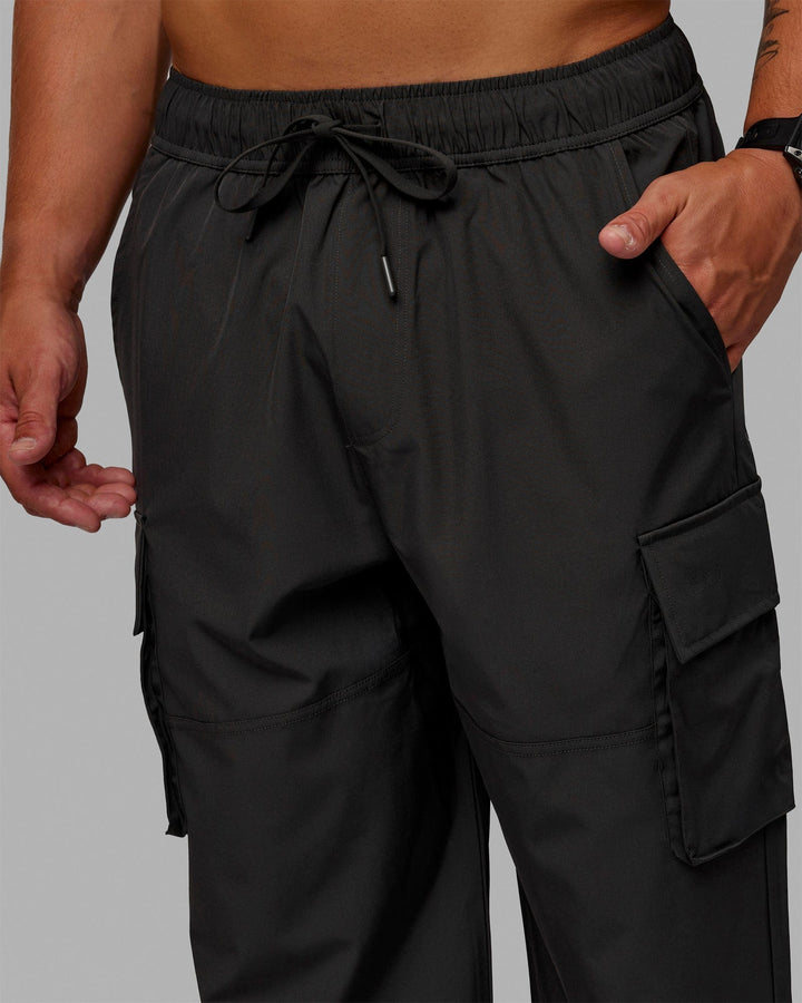 Man wearing Energy Stretch Relaxed Fit Cargo Pants - Pirate Black
