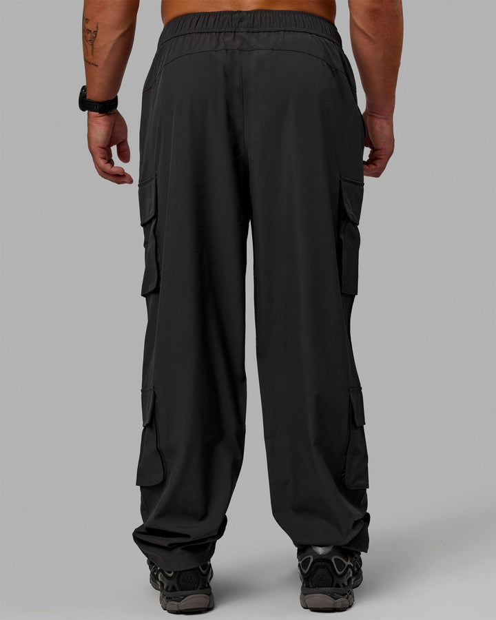 Man wearing Energy Stretch Relaxed Fit Cargo Pants - Pirate Black
