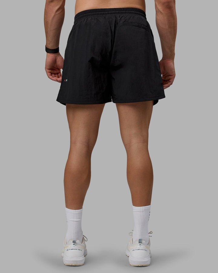 Man wearing Enjoy The Journey 5&quot; Shorts - Black-Multi
