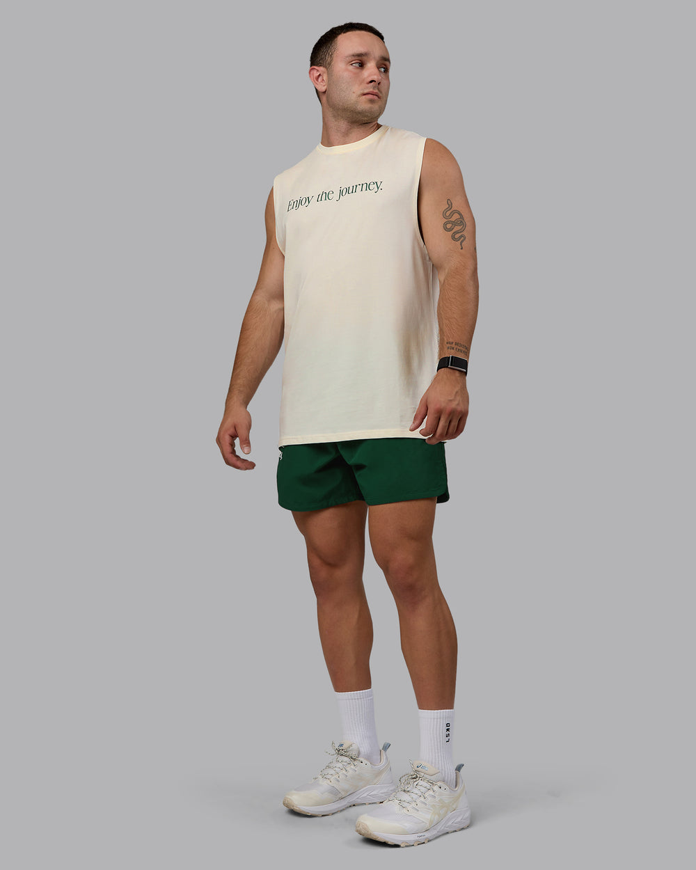 Man wearing Enjoy The Journey 5" Shorts - Deep Emerald-Off White