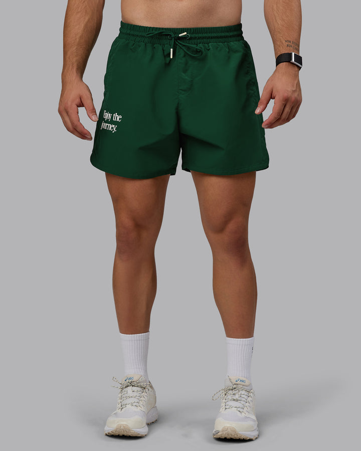 Man wearing Enjoy The Journey 5&quot; Shorts - Deep Emerald-Off White
