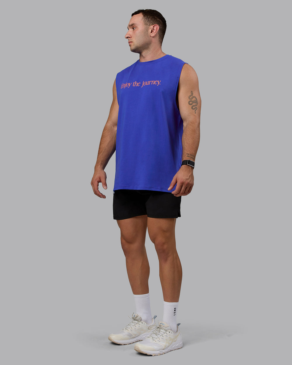 Man wearing Enjoy The Journey FLXCotton Tank - Power Cobalt-Orange