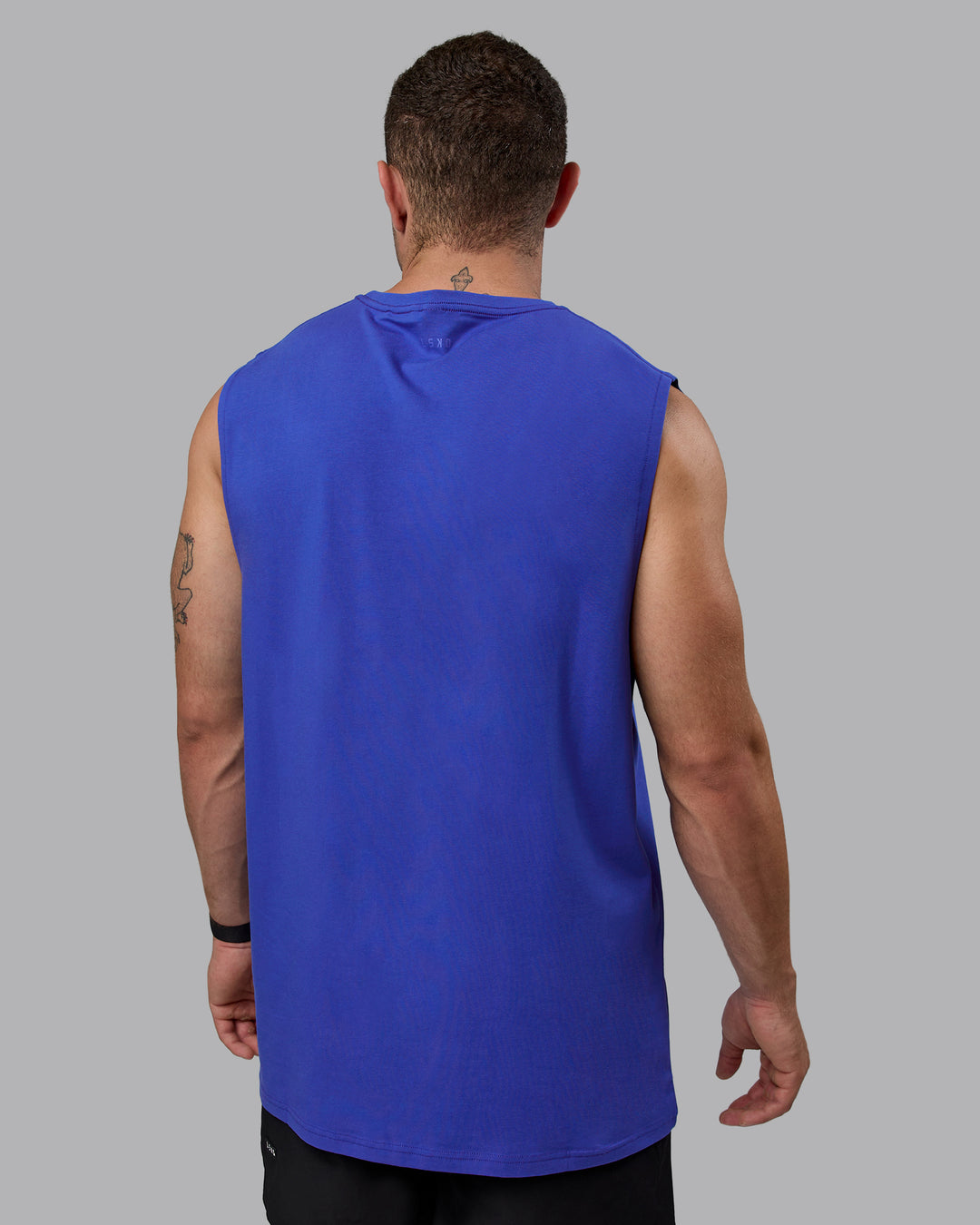 Man wearing Enjoy The Journey FLXCotton Tank - Power Cobalt-Orange