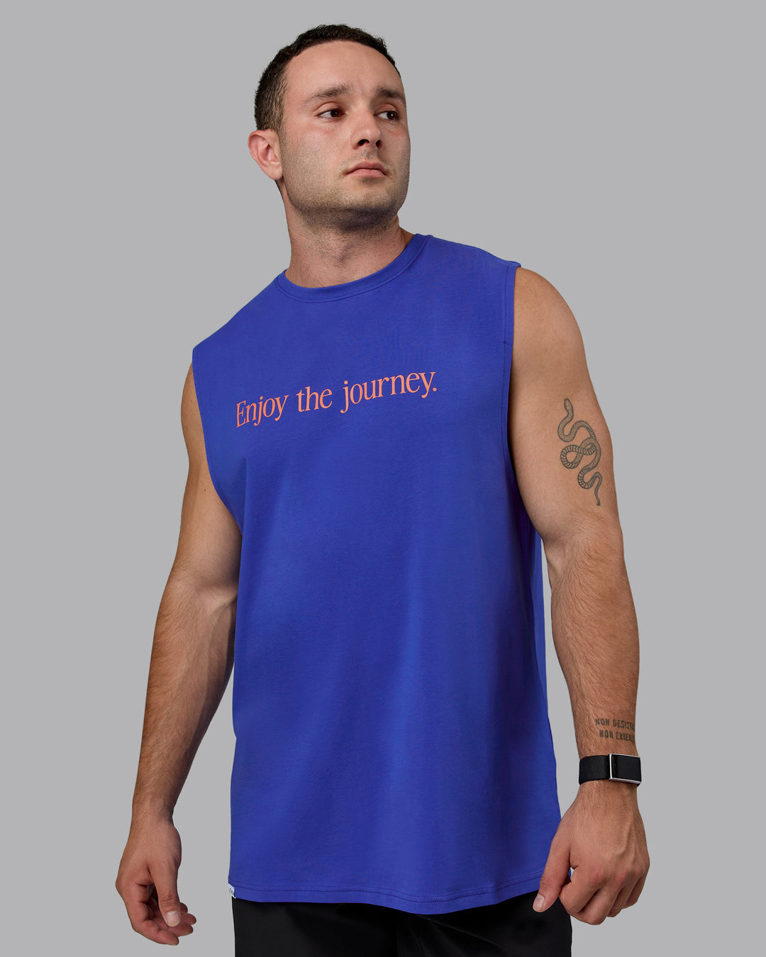 Man wearing Enjoy The Journey FLXCotton Tank - Power Cobalt-Orange