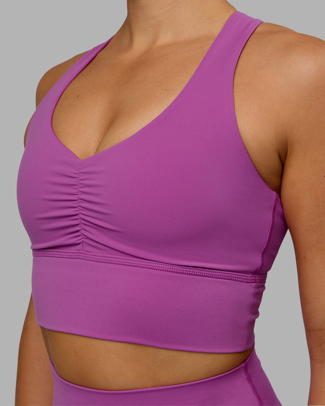 Woman wearing Evoke Sports Bra - Orchid