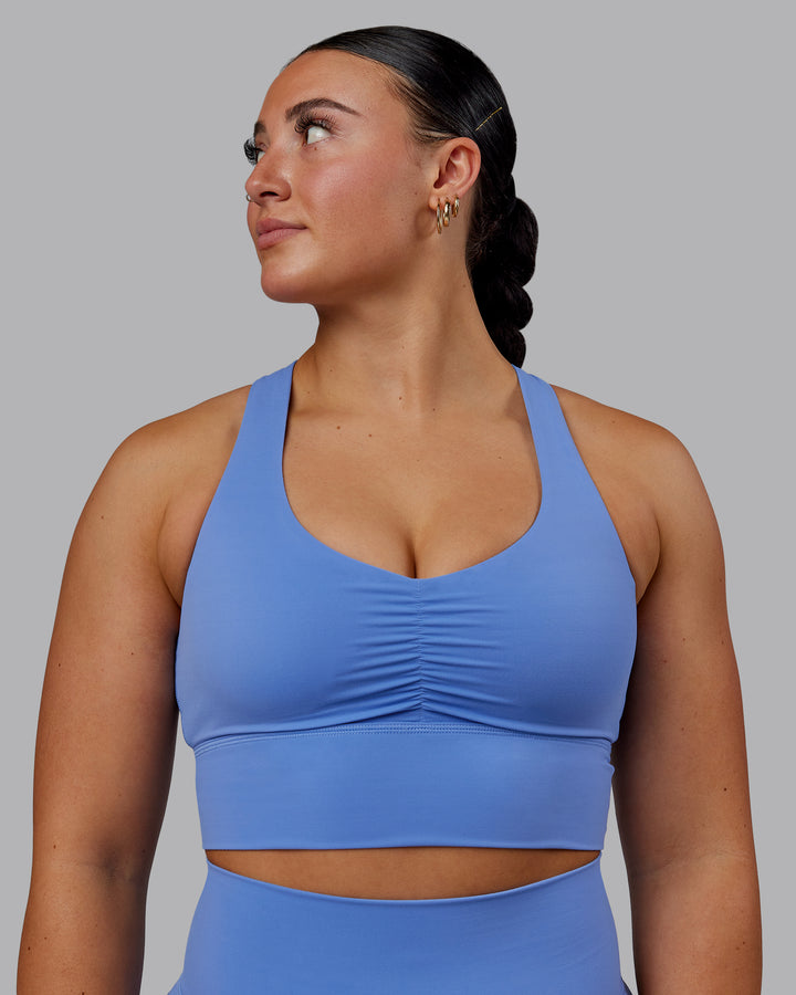 Woman wearing Evoke Sports Bra - Ultramarine
