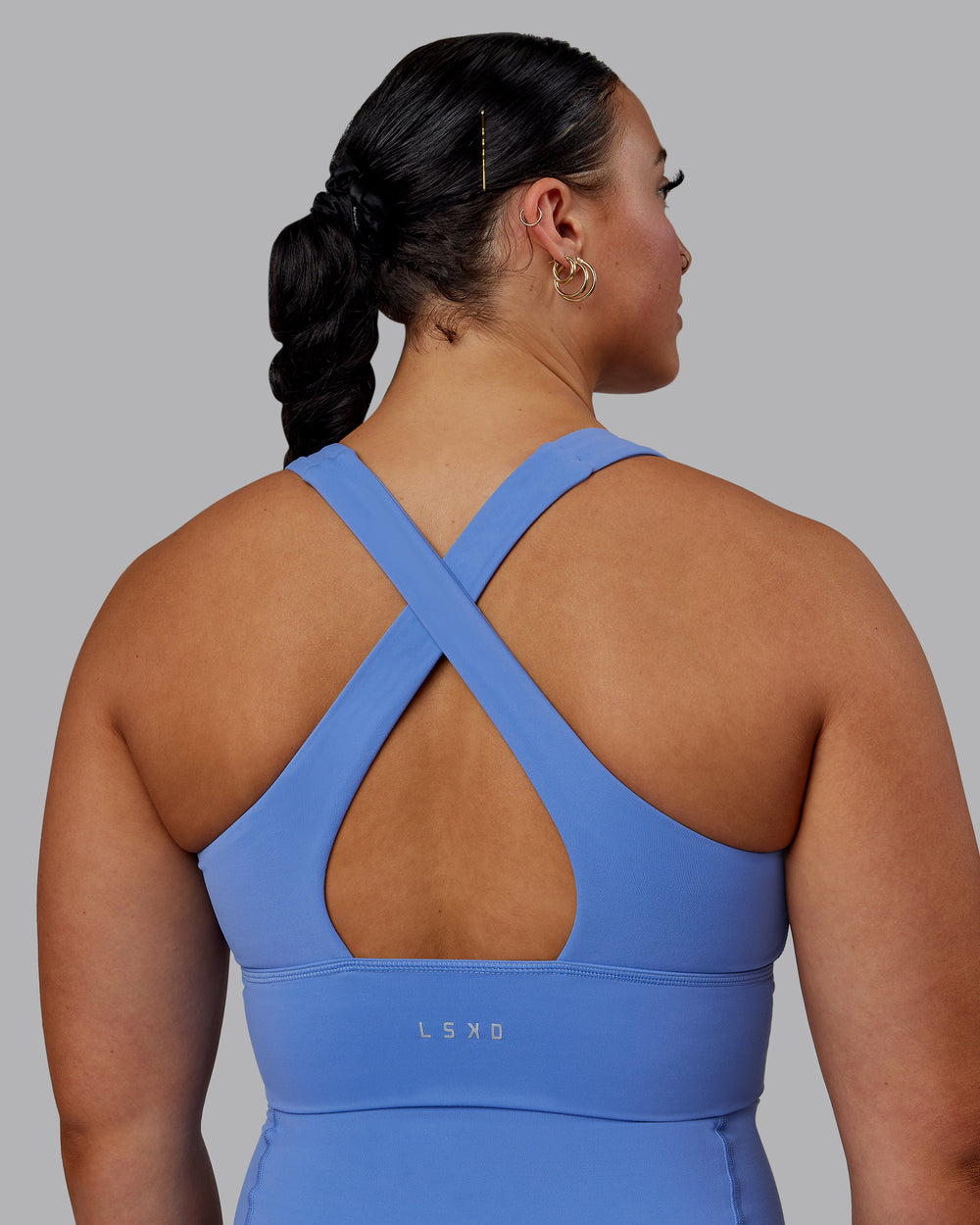 Woman wearing Evoke Sports Bra - Ultramarine