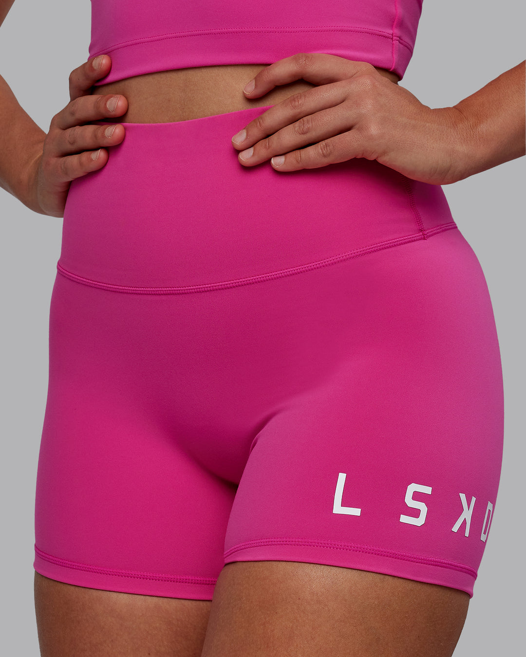 Woman wearing Evolved X-Short Tights - Fuchsia Pink-White