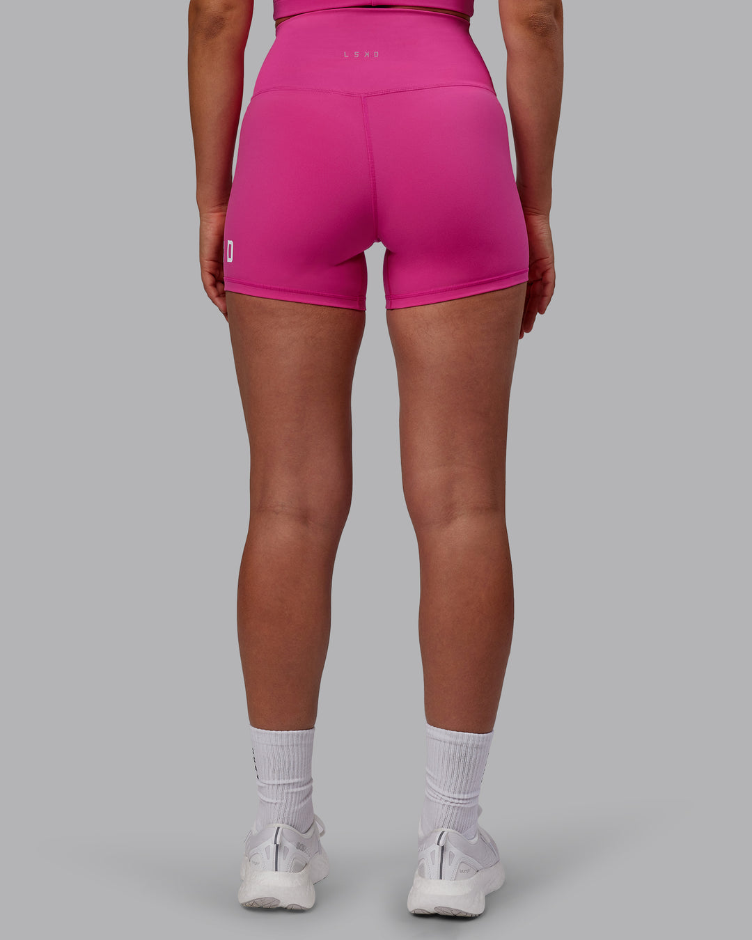 Woman wearing Evolved X-Short Tights - Fuchsia Pink-White