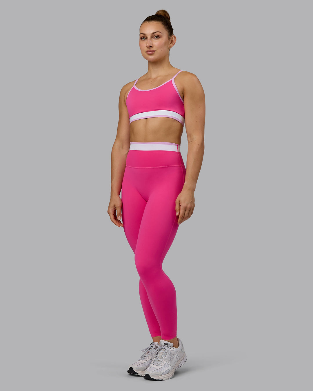 Woman wearing Excel Full Length Tights - Ultra Pink