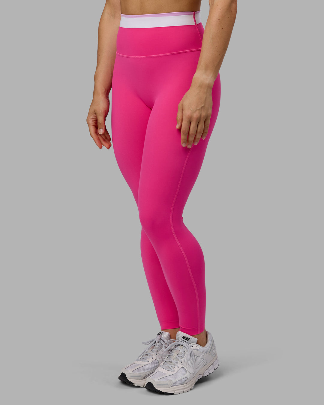 Woman wearing Excel Full Length Tights - Ultra Pink