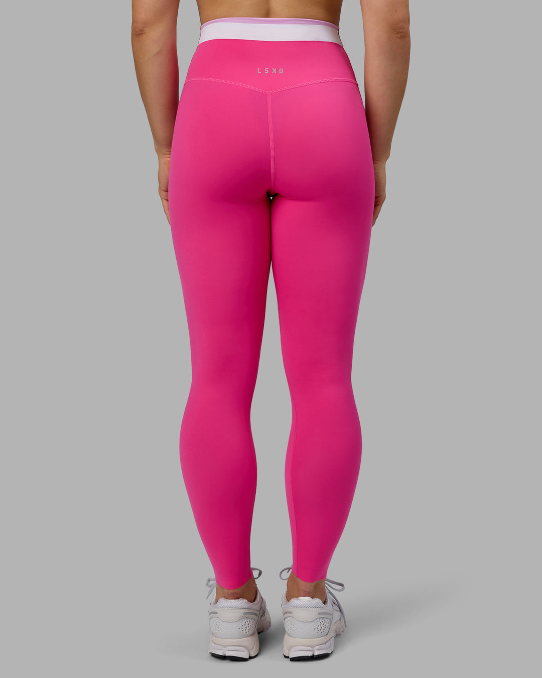 Woman wearing Excel Full Length Tights - Ultra Pink