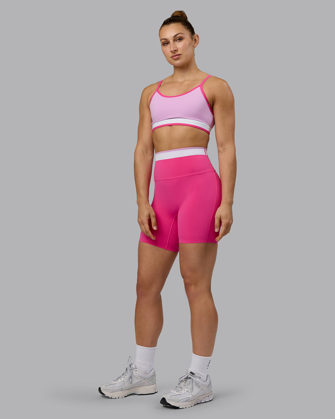 Woman wearing Excel Mid Short Tights - Ultra Pink