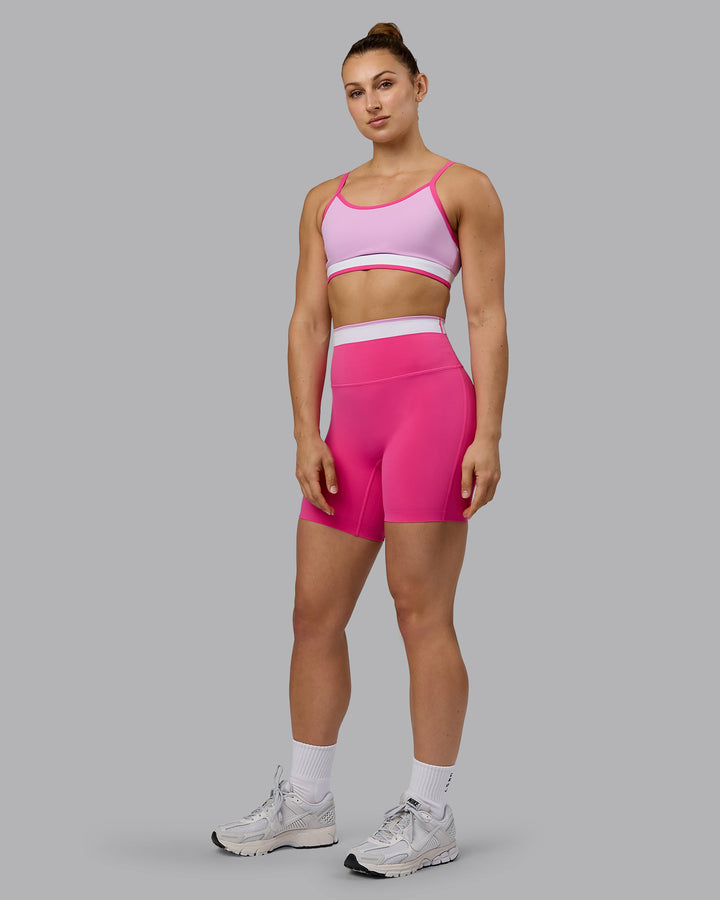 Woman wearing Excel Mid Short Tights - Ultra Pink
