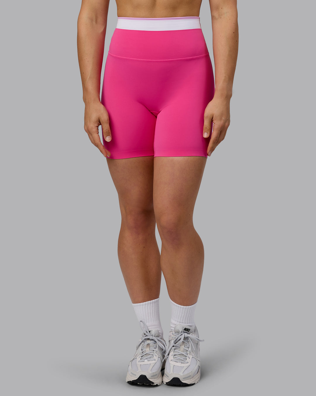 Woman wearing Excel Mid Short Tights - Ultra Pink