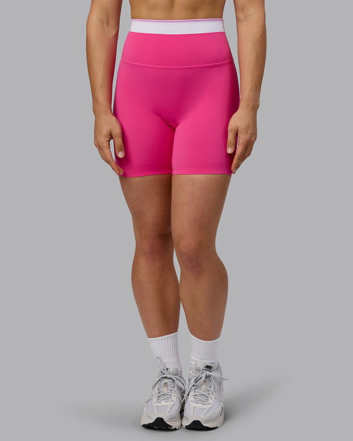 Woman wearing Excel Mid Short Tights - Ultra Pink
