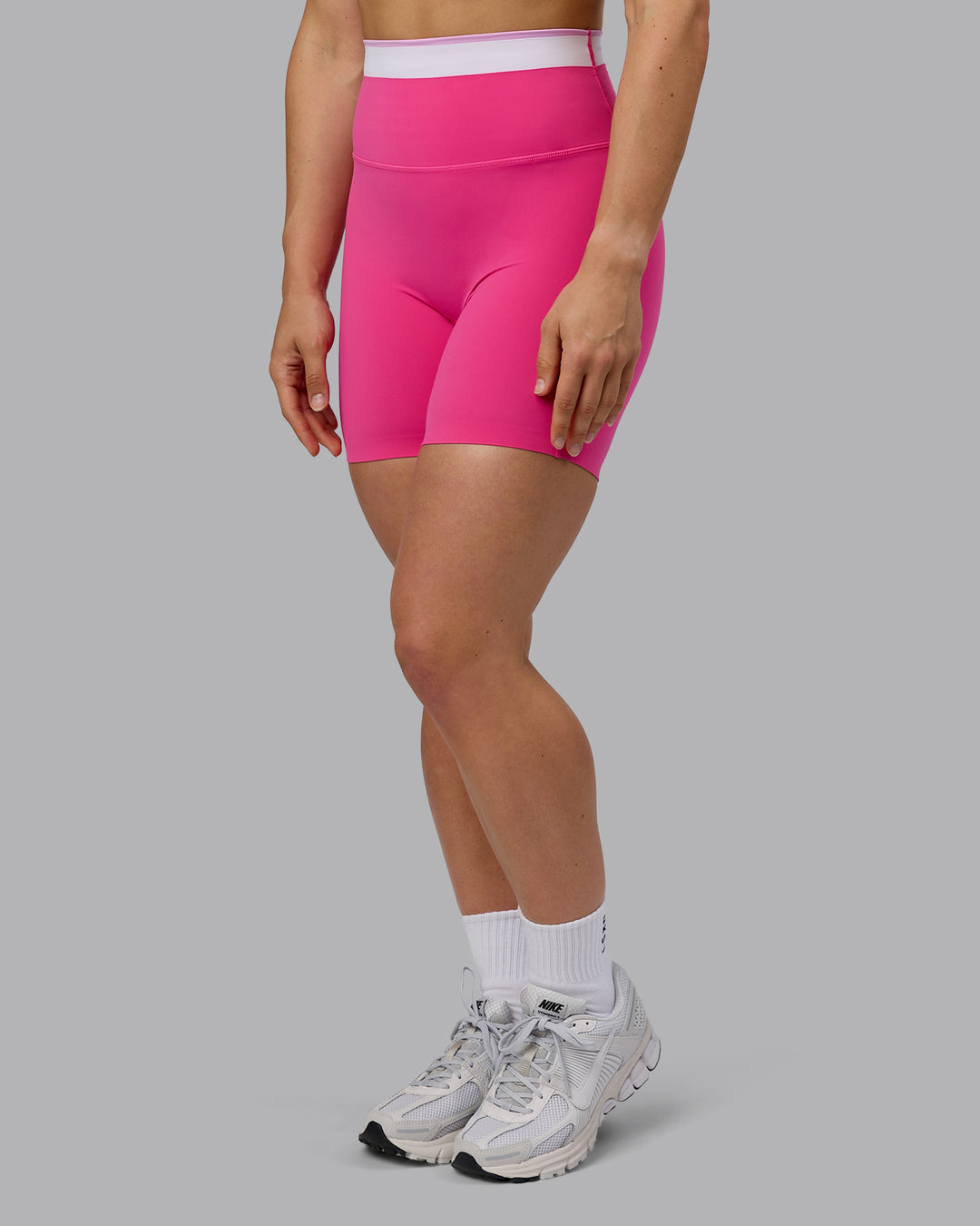 Woman wearing Excel Mid Short Tights - Ultra Pink