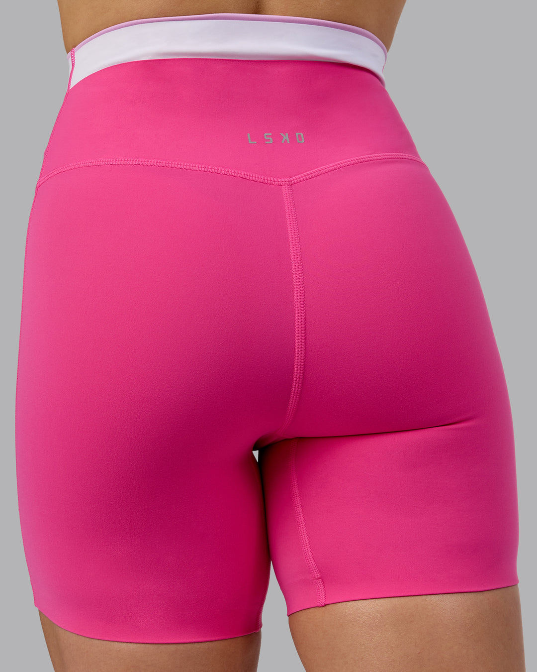 Woman wearing Excel Mid Short Tights - Ultra Pink