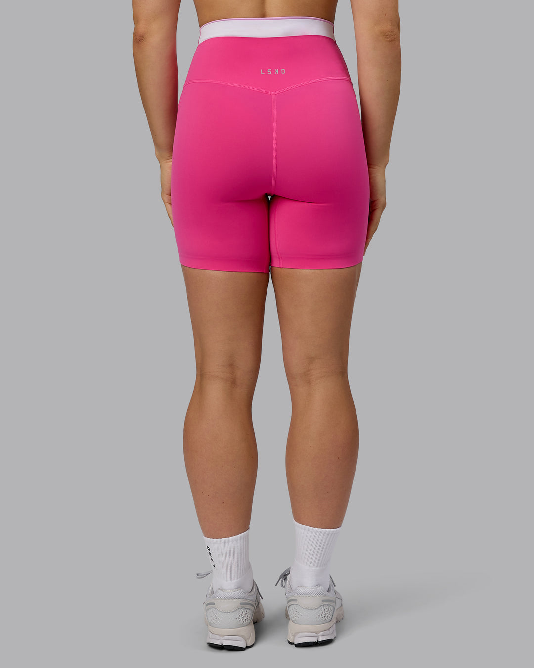 Woman wearing Excel Mid Short Tights - Ultra Pink