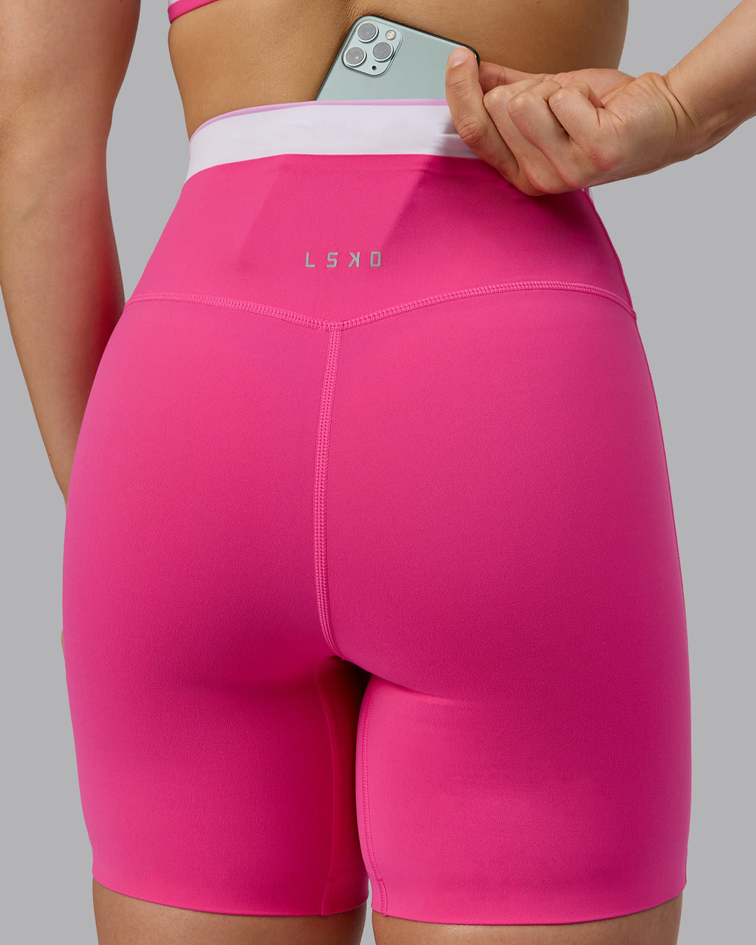 Woman wearing Excel Mid Short Tights - Ultra Pink