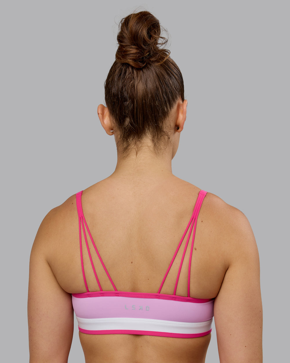 Woman wearing Excel Sports Bra - Pastel Orchid