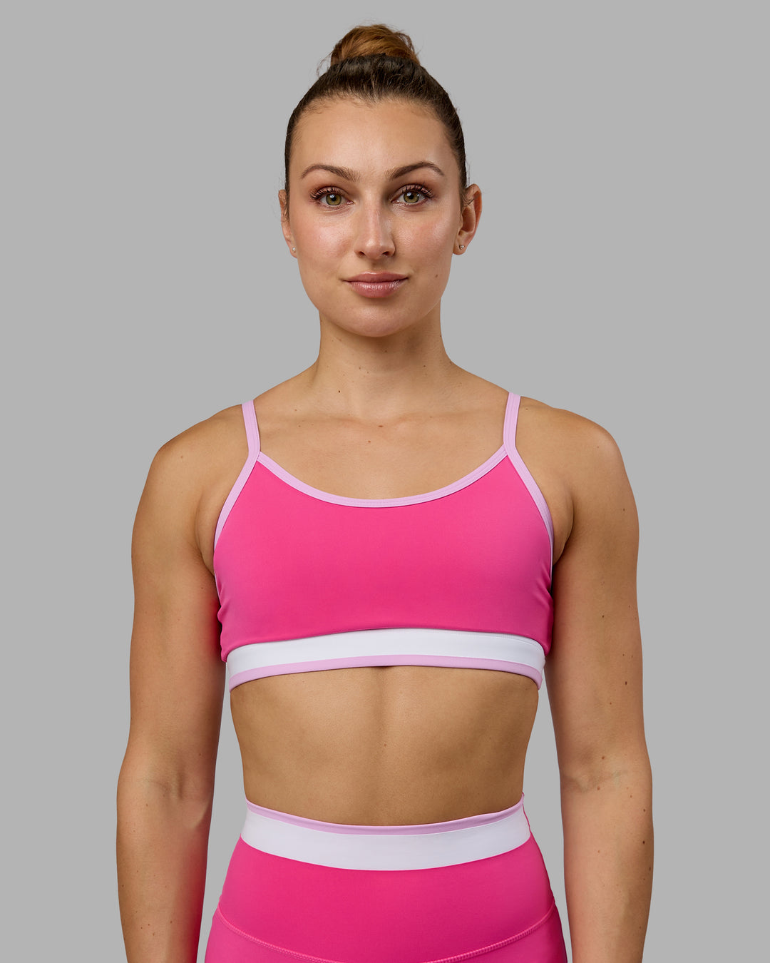 Woman wearing Excel Sports Bra - Ultra Pink