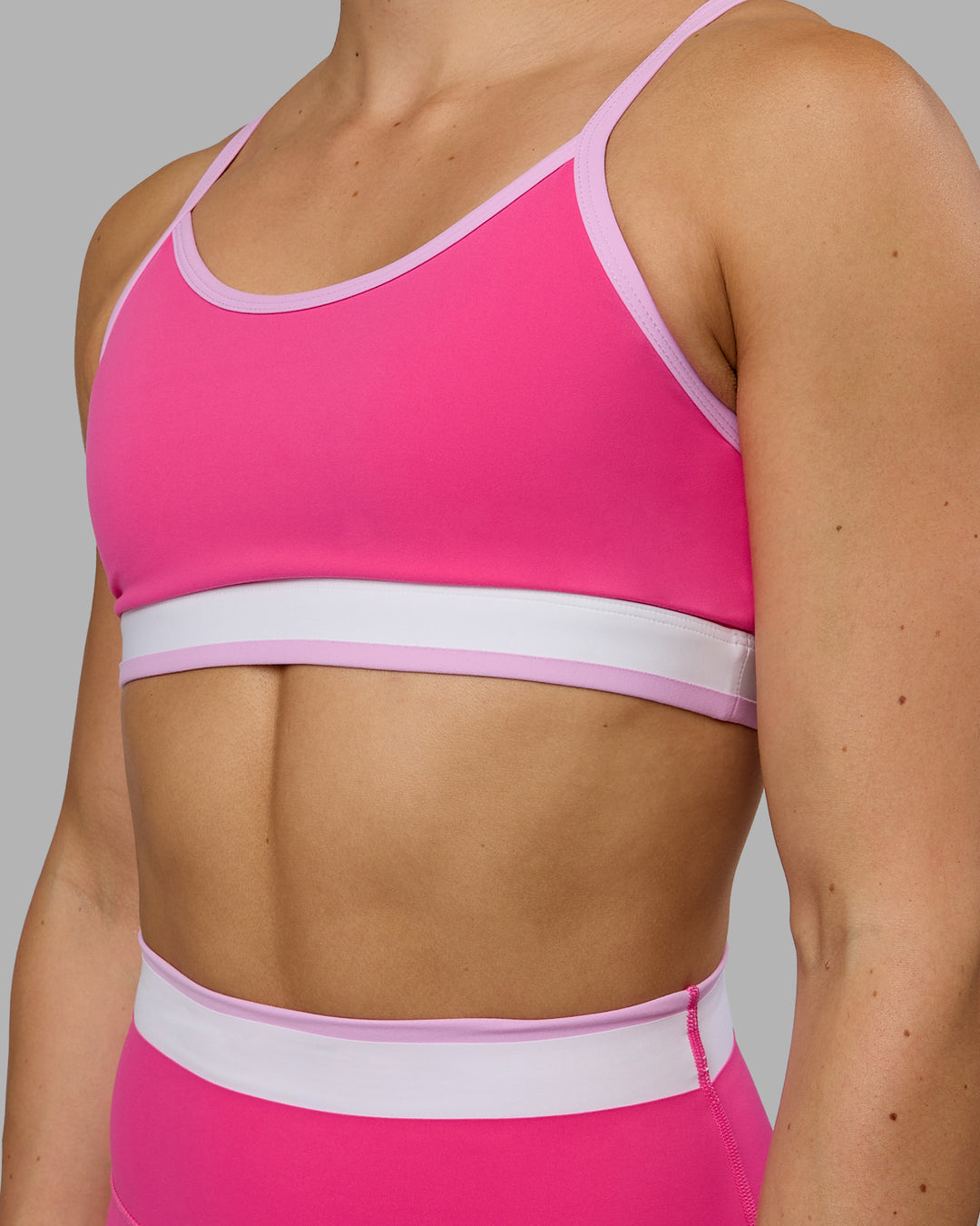 Woman wearing Excel Sports Bra - Ultra Pink