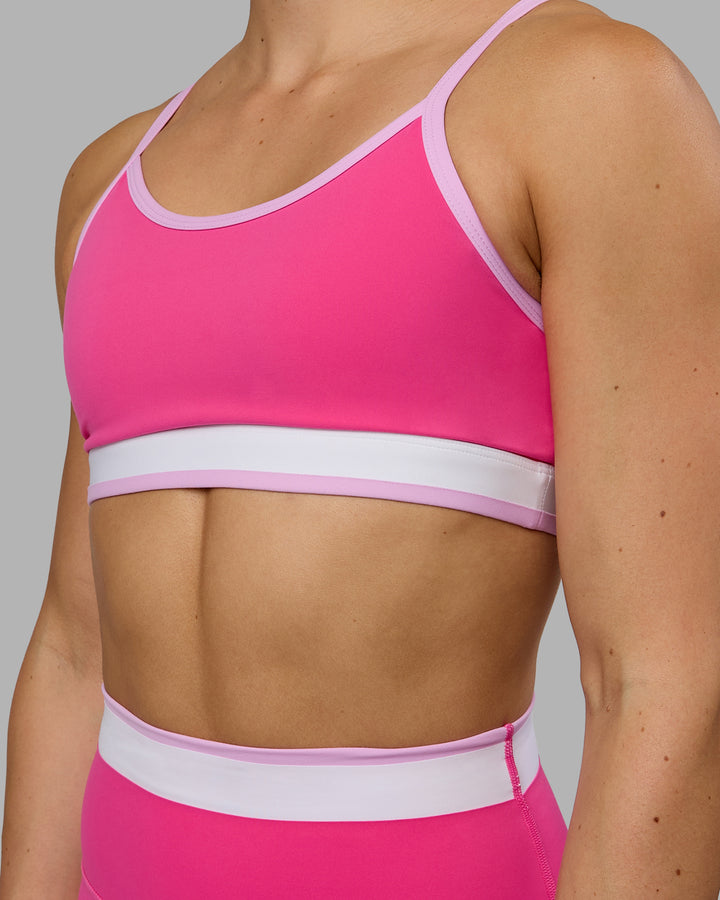 Woman wearing Excel Sports Bra - Ultra Pink
