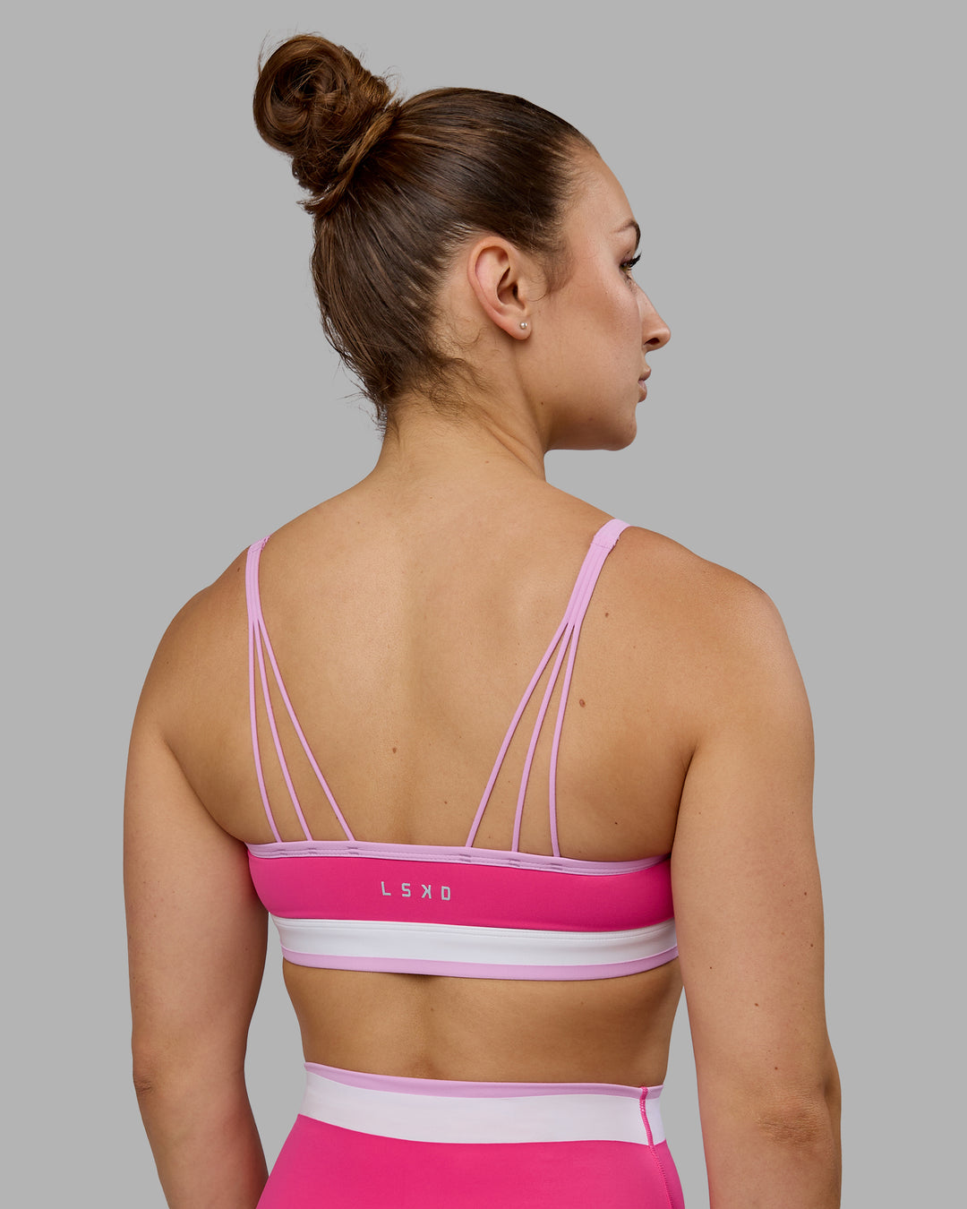 Woman wearing Excel Sports Bra - Ultra Pink