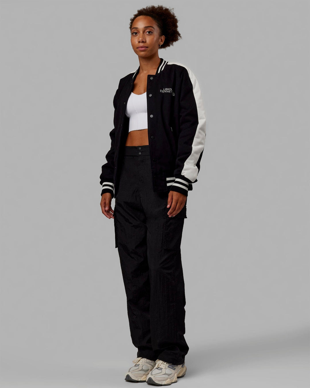 Woman wearing Unisex Fitness Club Bomber Jacket - Black-Off White