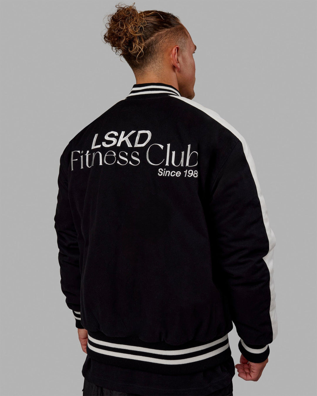 Man wearing Unisex Fitness Club Bomber Jacket - Black-Off White