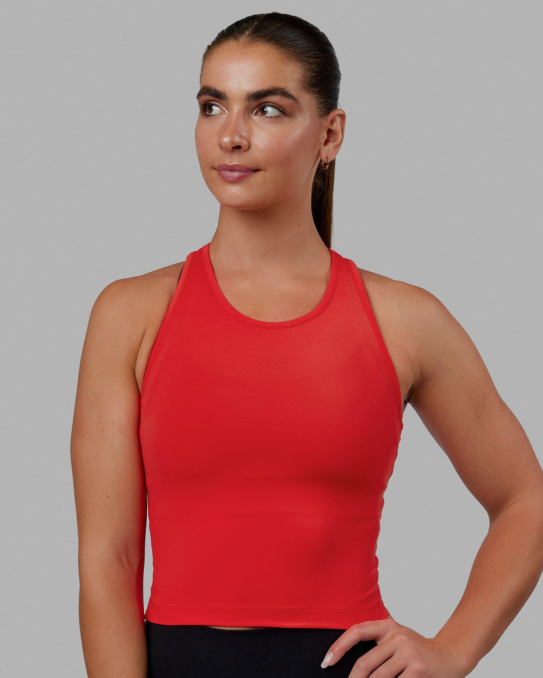 Woman wearing Flow Performance Tank - Infrared