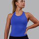 Woman wearing Flow Performance Tank - Power Cobalt