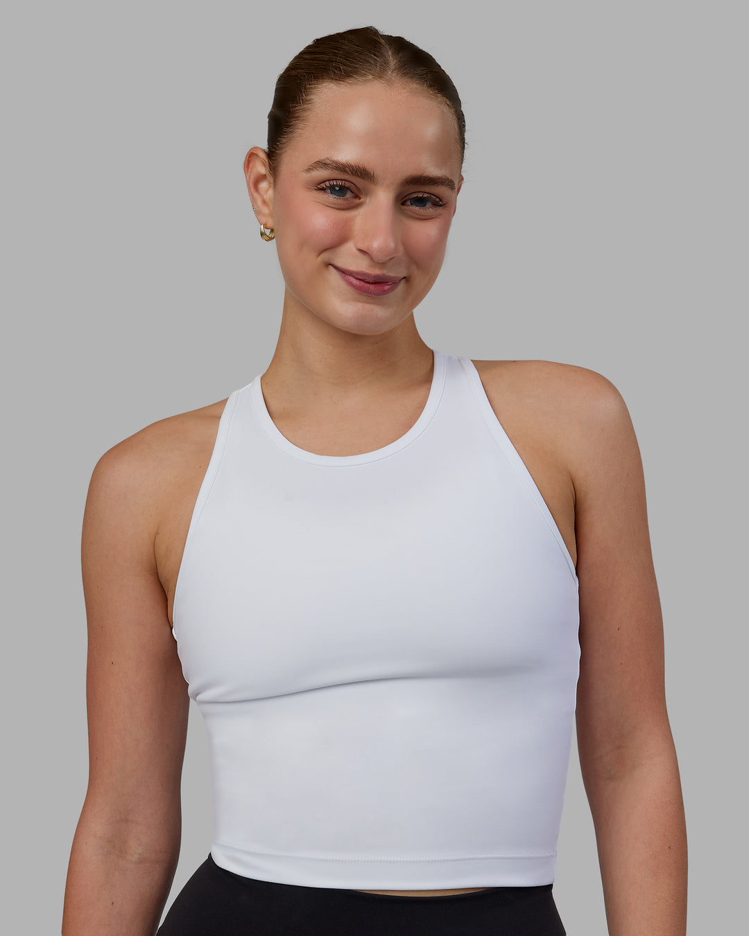 Woman wearing Flow Performance Tank - White