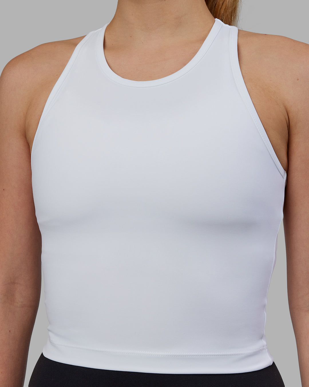 Woman wearing Flow Performance Tank - White