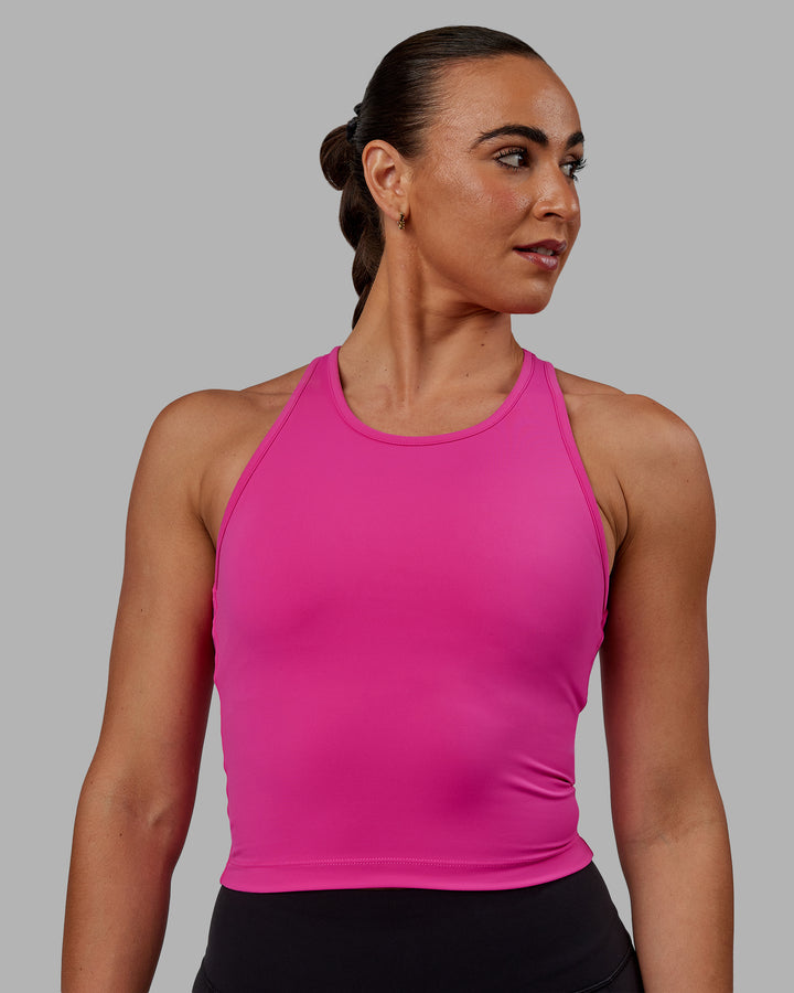 Woman wearing Flow Shelf Bra Performance Tank - Fuchsia Pink
