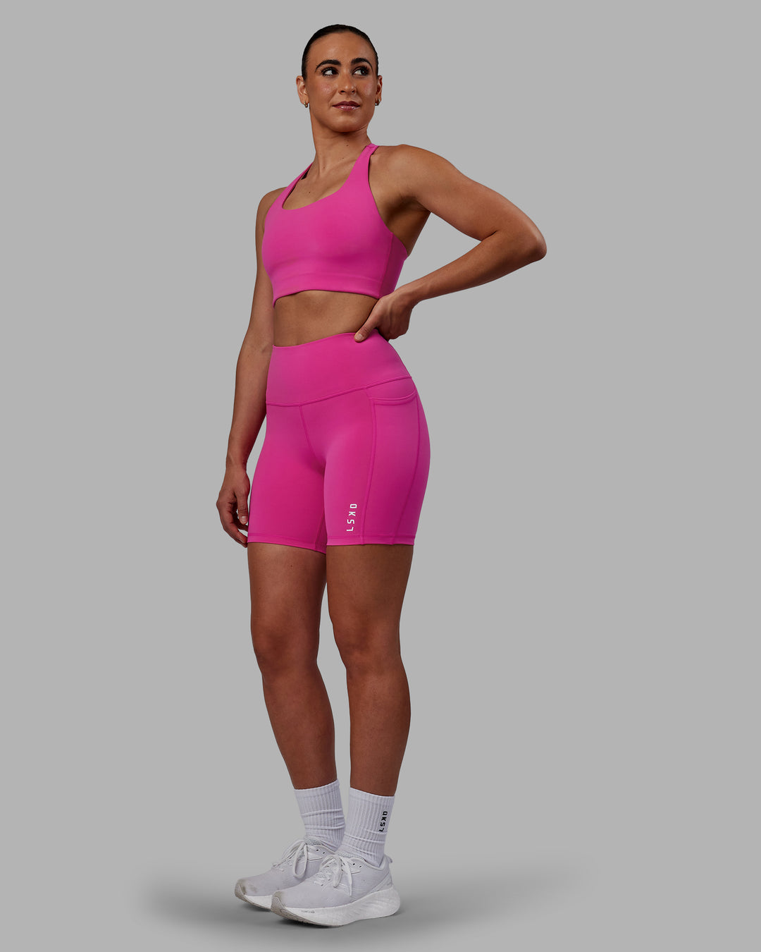 Woman wearing Flux Mid Short Tights - Fuchsia Pink