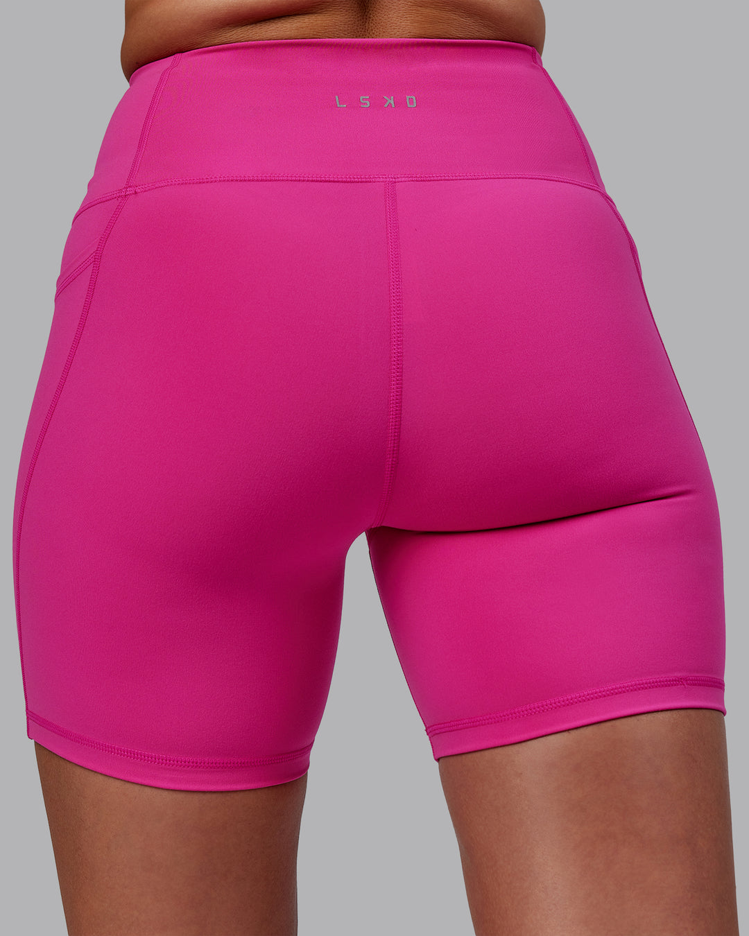 Woman wearing Flux Mid Short Tights - Fuchsia Pink