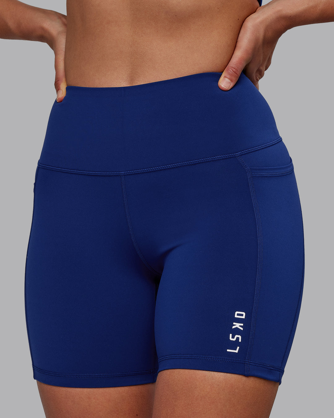 Woman wearing Flux Mid Short Tights - Midnight Blue