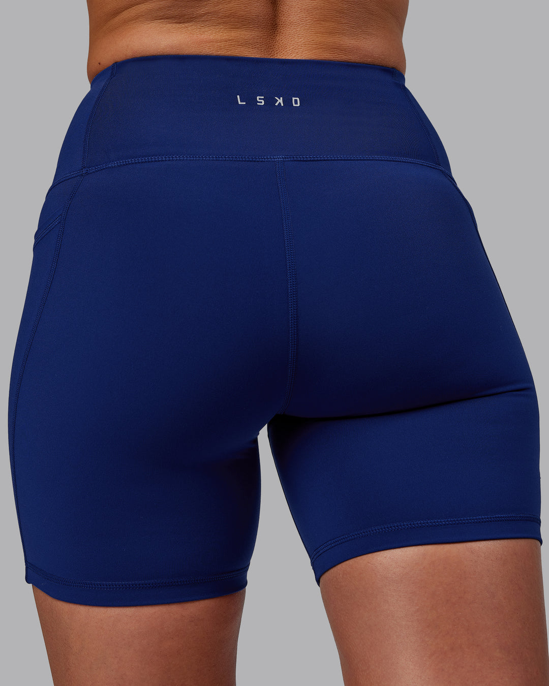 Woman wearing Flux Mid Short Tights - Midnight Blue