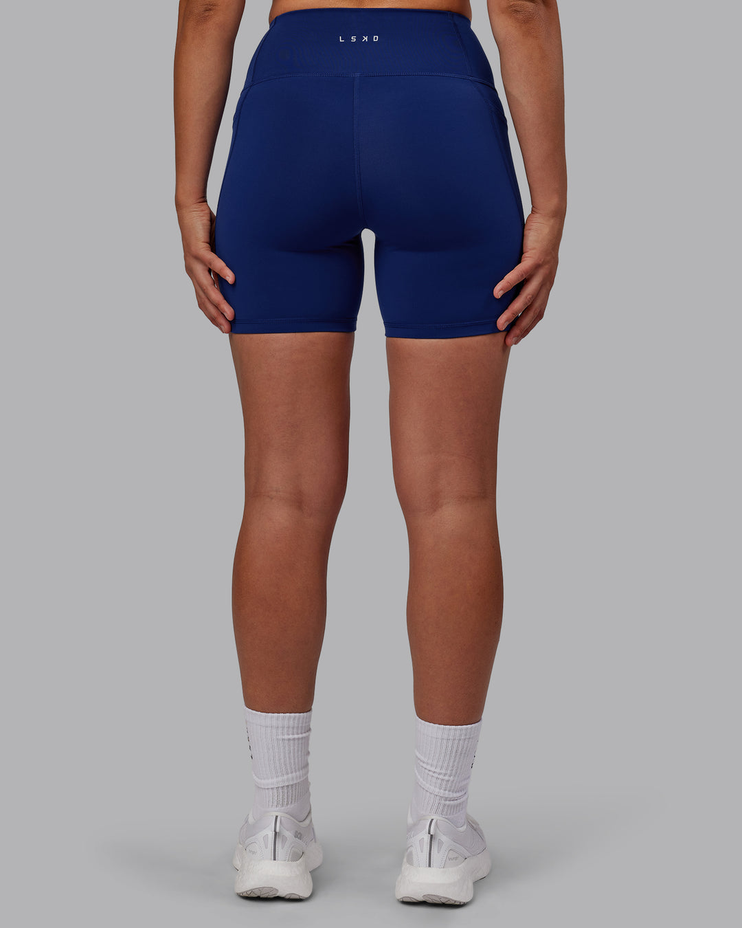 Woman wearing Flux Mid Short Tights - Midnight Blue