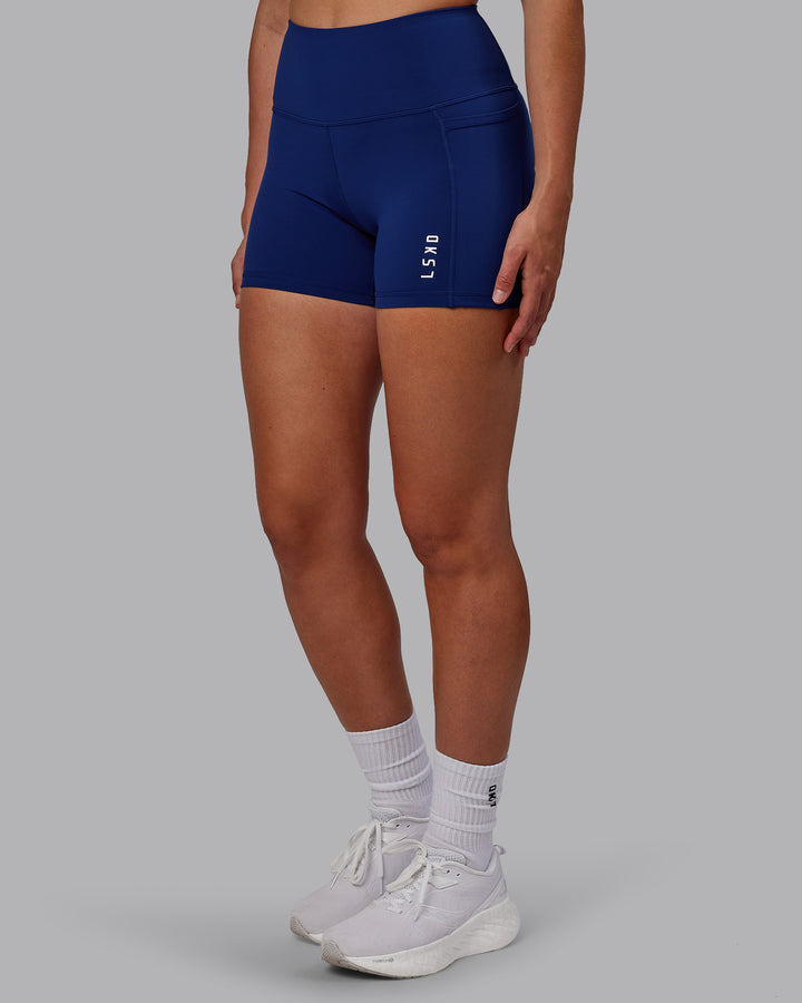 Woman wearing Flux X Short Tights - Midnight Blue
