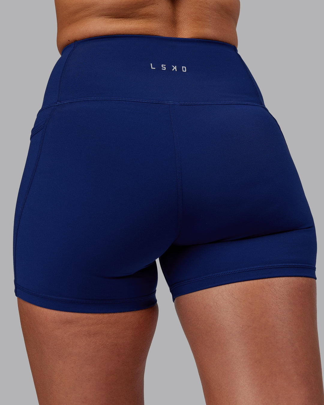 Woman wearing Flux X Short Tights - Midnight Blue