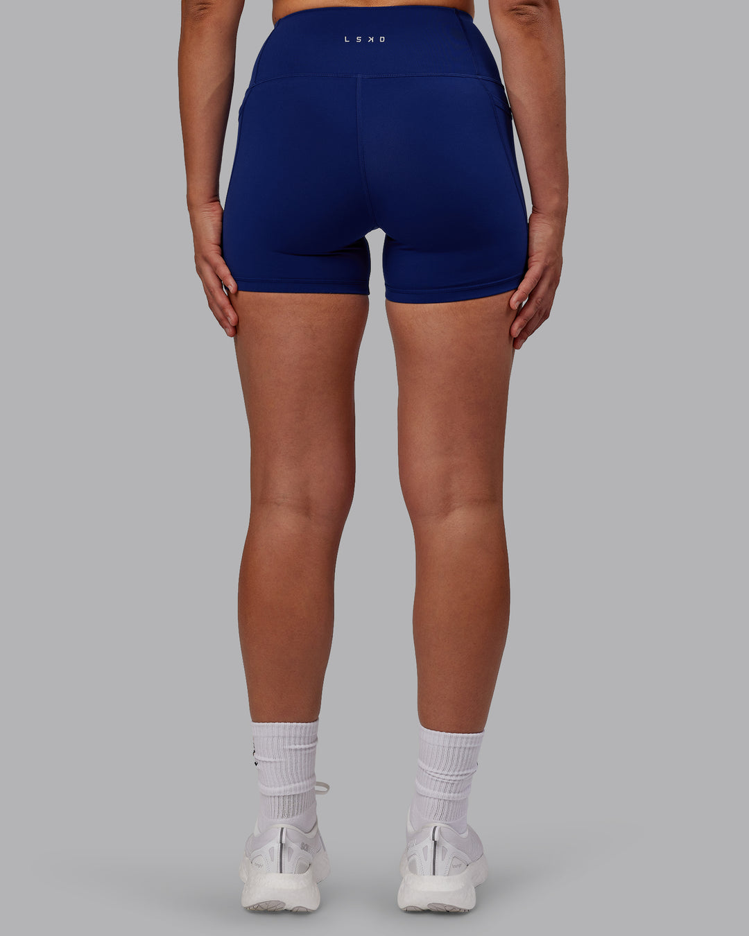 Woman wearing Flux X Short Tights - Midnight Blue