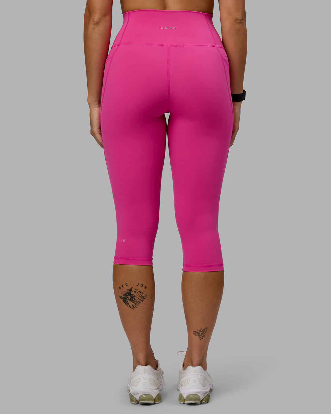 Woman wearing Fusion 3/4 Length Tights - Fuchsia Pink